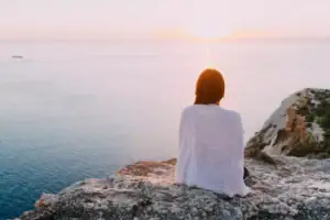 A woman with one of the most common co-occurring disorders watching the sunset.