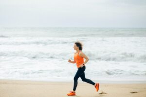A woman learning how to cope with anxiety and depression by jogging