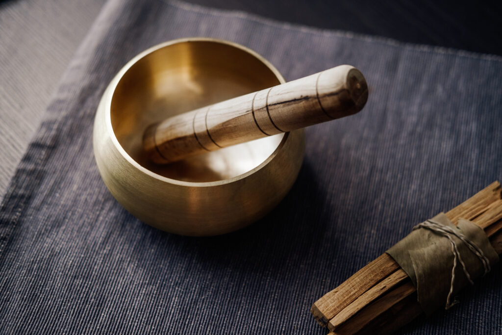 Singing bowl as part of a sound bath therapy session - Amend Treatment