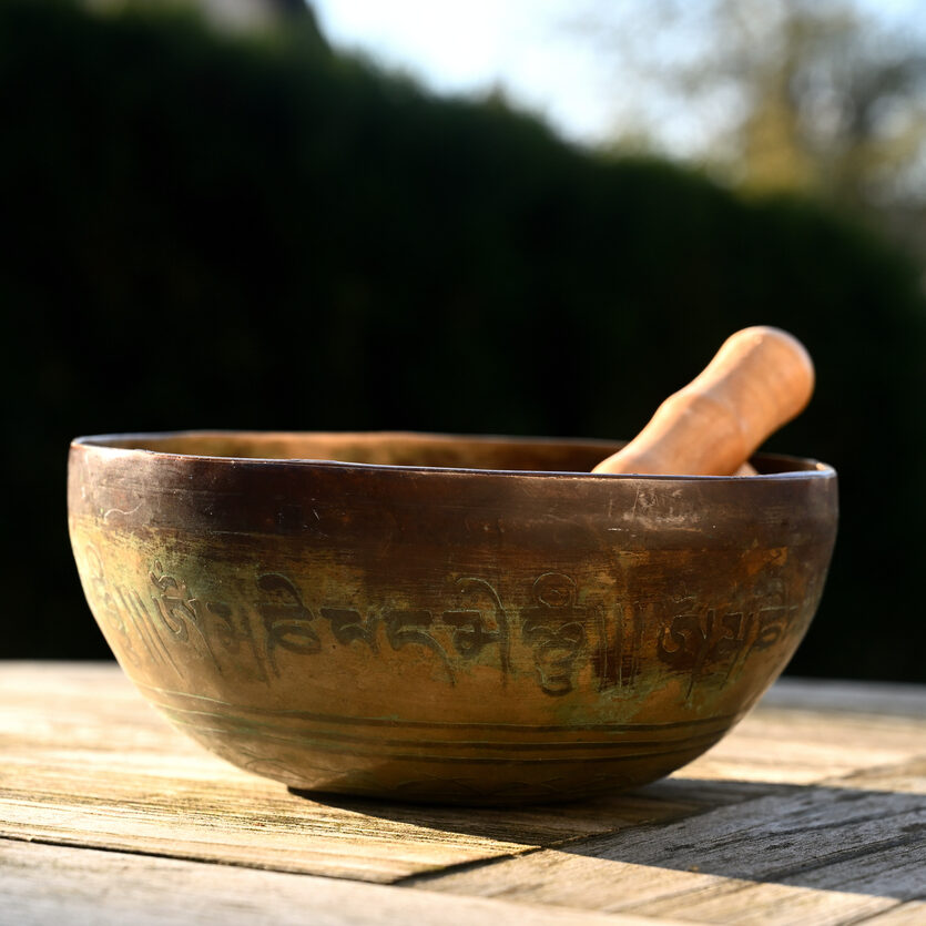 Tibetan singing bowl on a table outdoor